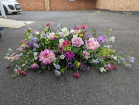Garden Style Casket Spray   Pinks, lilacs and blues